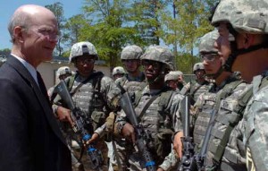 Soldiers speaking to important person at Fort Benning