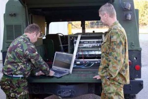 Two solders act like working in Fort Gordon Garrison Command