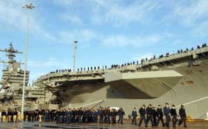 Naval Construction Battalion Center In front of boat