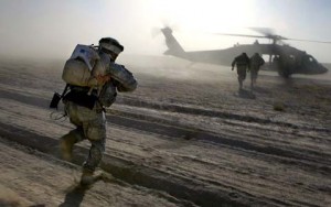 Soldiers running to helicopter at Camp Dwyer