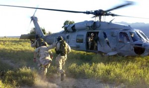 Soldiers jumps into helicopter at NAS Fallon