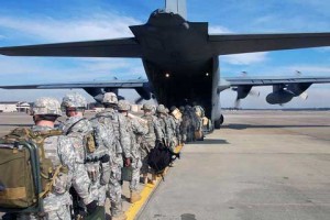 Soldiers getting to plane at Pope AFB
