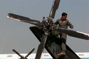 Soldier repairing plane at Camp Doha