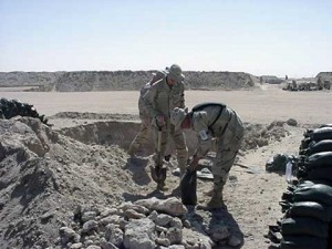 Soldiers filling sandbags at Camp Doha