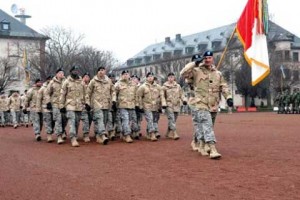 Soldiers marching with flag at Campbell Barracks