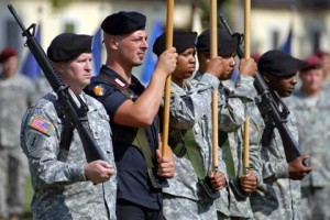 Soldiers holding flags at Caserma Ederle