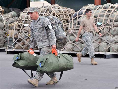 Transit Center at Manas soldier Soldier carrying bags at Transit Center at Manas